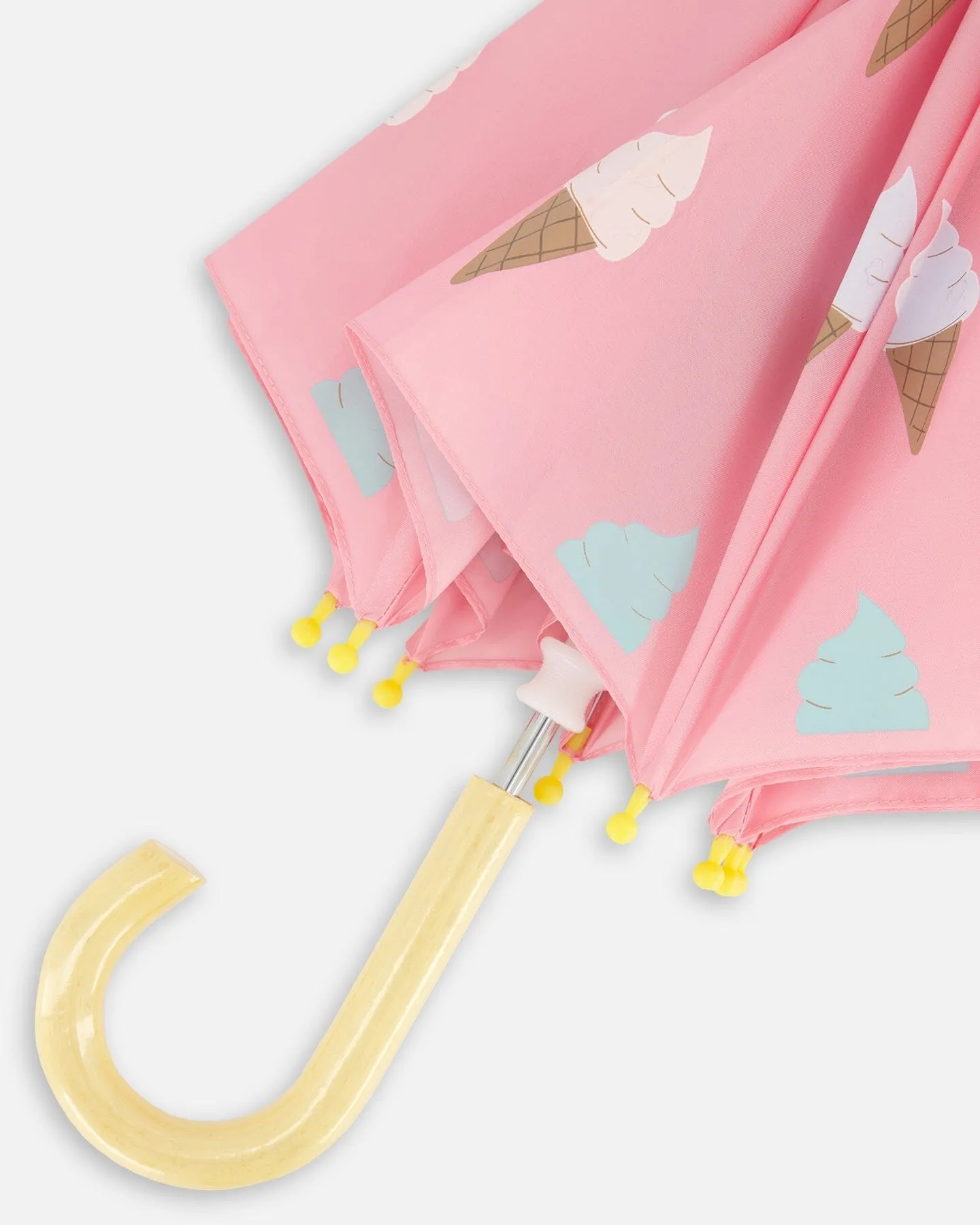 Pink Umbrella With Cones That Change Color Upon Contact With Water