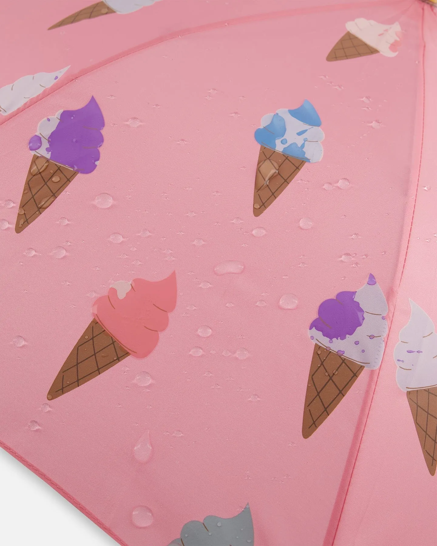 Pink Umbrella With Cones That Change Color Upon Contact With Water